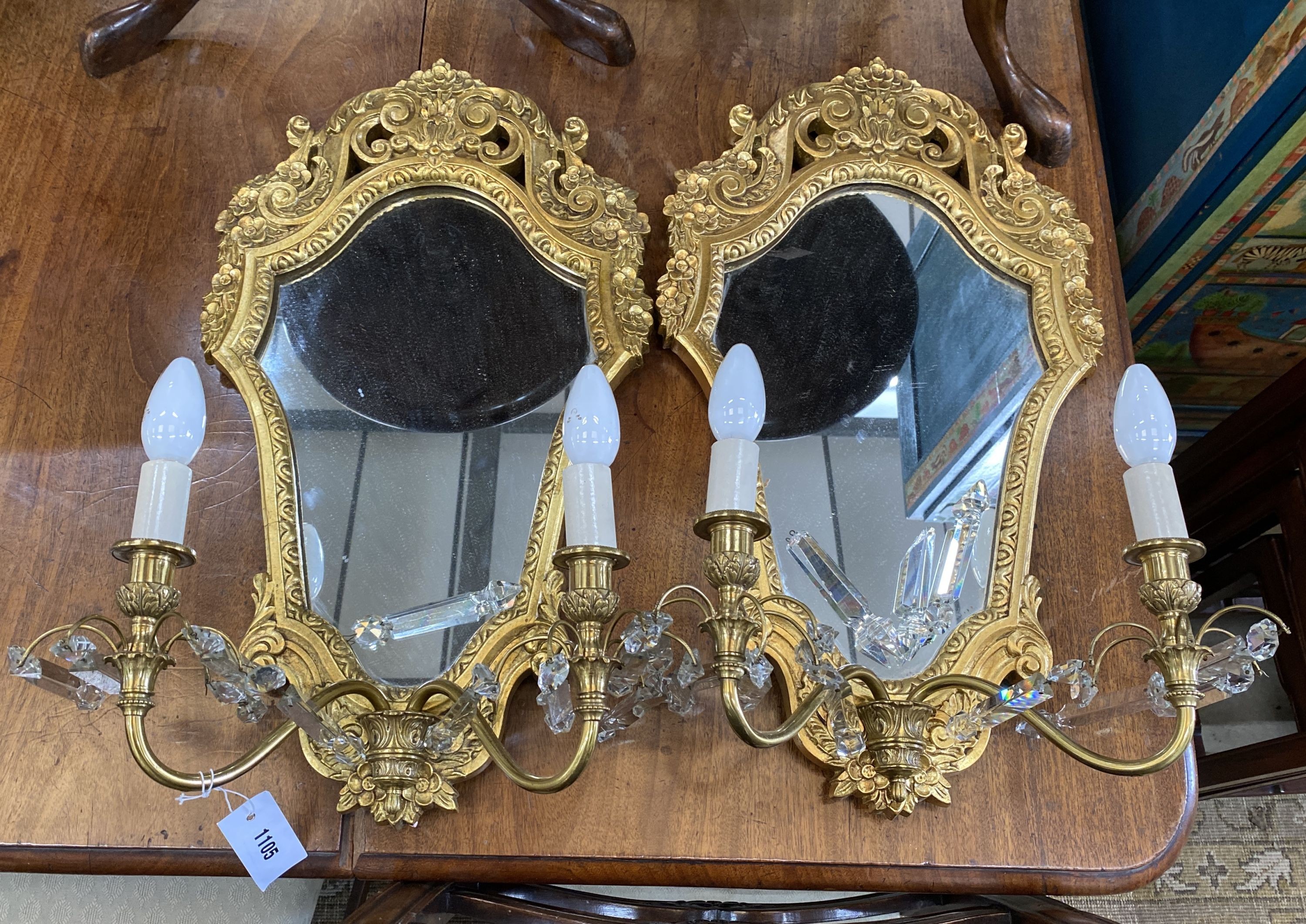 A pair of gilt framed cartouche shaped electric girandoles, width 35cm, height 60cm